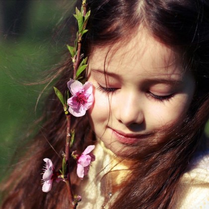 Cute girl with pink flower