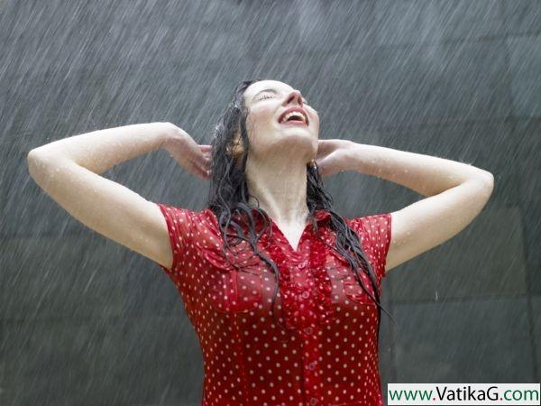 Red dress girl enjoying raining